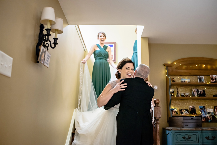 A father hugging his daughter on her wedding day.